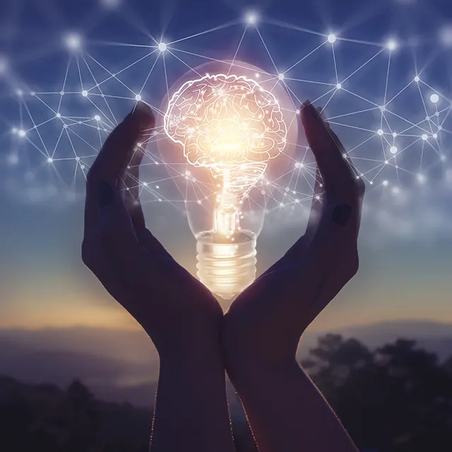 a bulb in hand with light